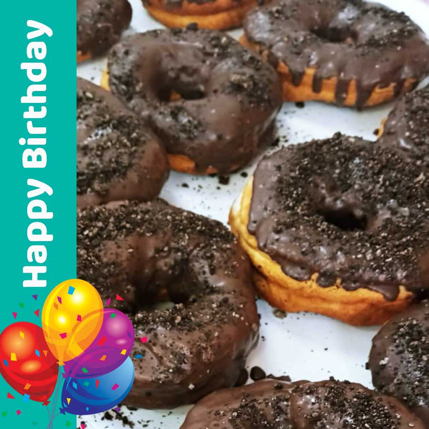 A Doughnut dipped in Chocolate with Oreos